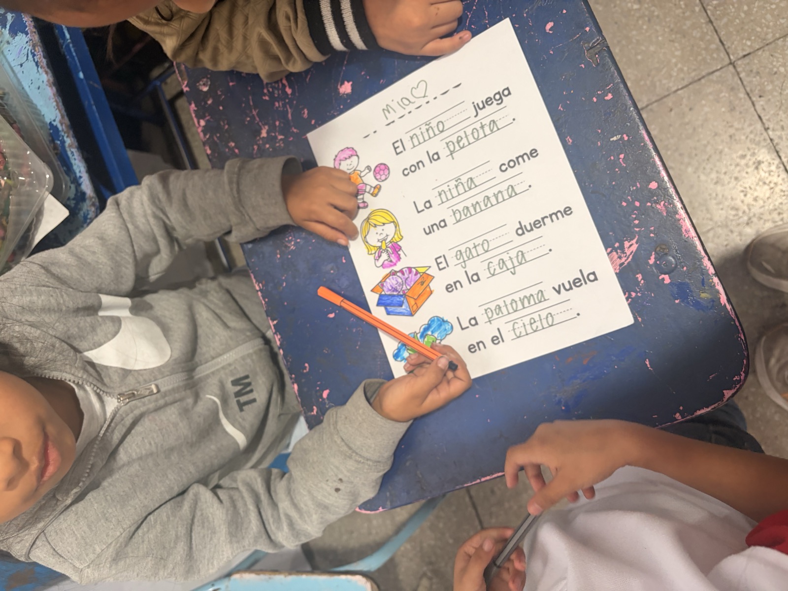A student's completed English worksheet from class in Antigua